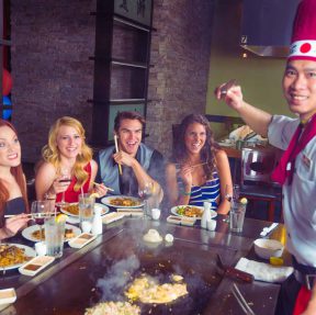 Chef with teppanyaki guests