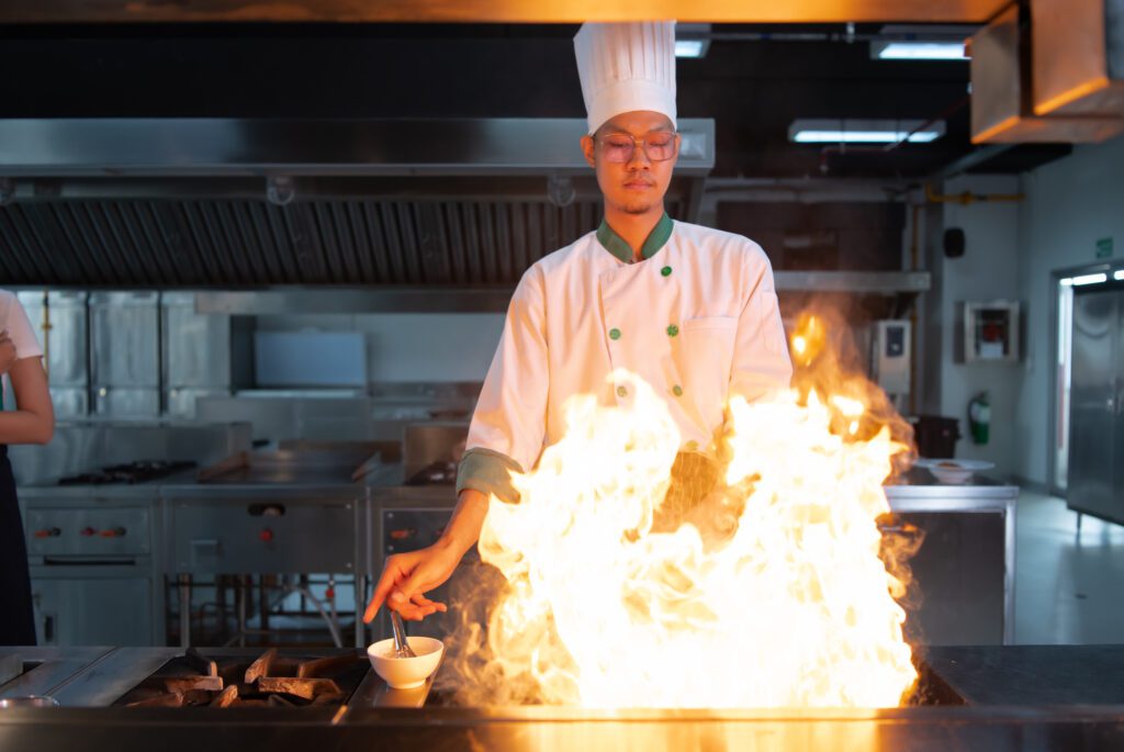 Chef cooking teppanyaki style food