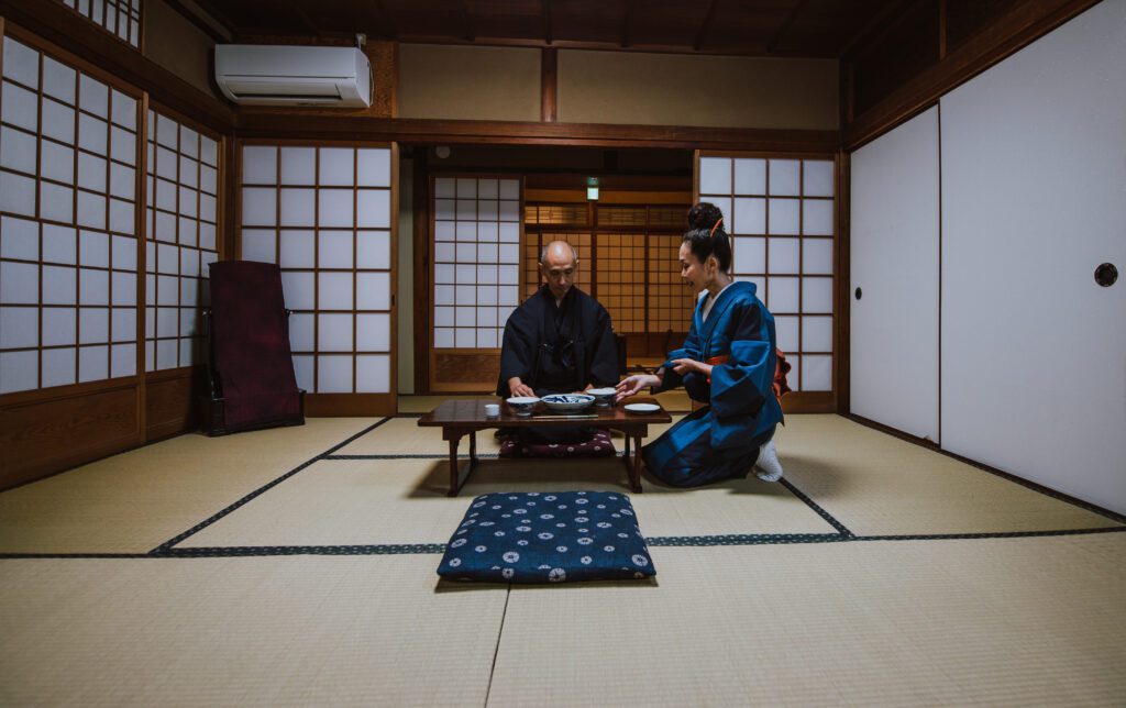 Japanese couple practicing Japanese etiquette in seating
