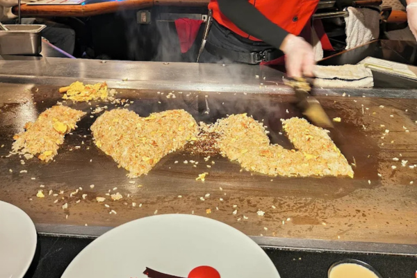 hibachi fried rice prepared on teppan griddle